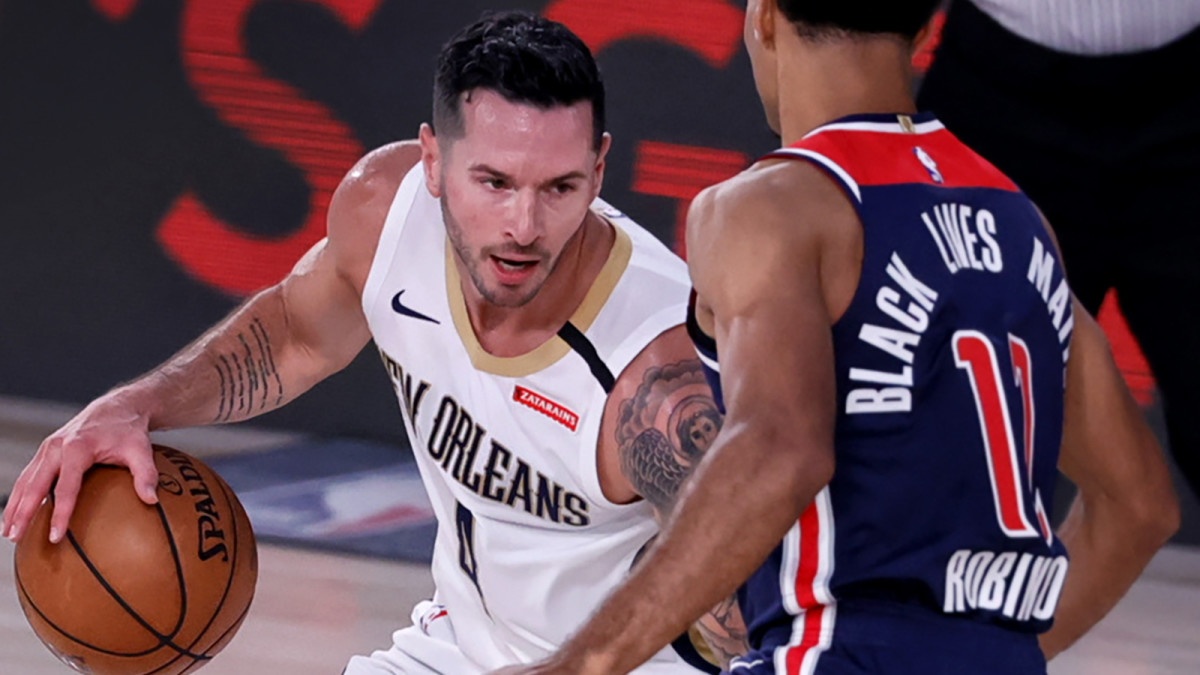 JJ Redick dribbles